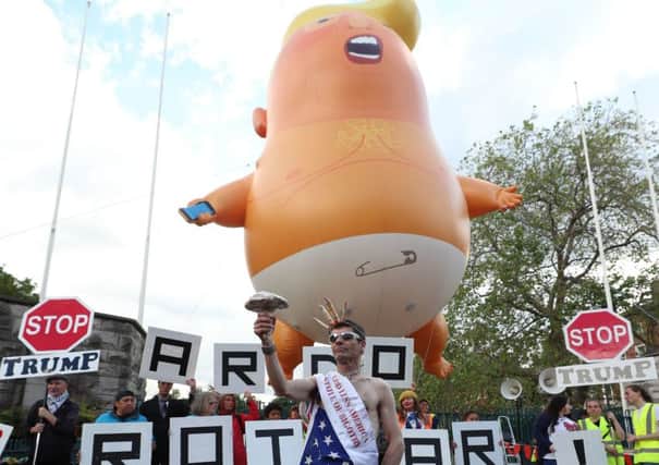 Joseph Campbell from Belfast stands in front of the Trump baby blimp which is flown at the Garden of Remembrance in Dublin, during US President Donald Trump's visit to the Republic of Ireland. PRESS ASSOCIATION Photo. Picture date: Thursday June 6, 2019. See PA story IRISH Trump. Photo credit should read: Liam McBurney/PA Wire
