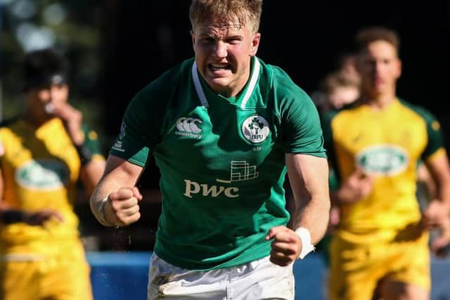 Ireland and Malone player Stewart Moore celebrates scoring a try against Australia