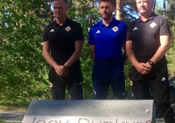 NI manager Michael O'Neill, Stuart Dallas and Jimmy Nicholl at paying their respects at the Joey Dunlop memorial near Tallinn, Estonia. Photo: Stephen Watson -Twitter