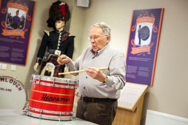 Veteran pipe band drummer Wilby Hanna (Upper Crossgare LOL 1608) playing one of the innovative drums he designed and built in 1981