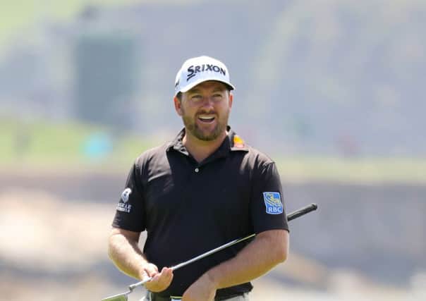 Graeme McDowell of Northern Ireland reacts to a shot on the 18th green during a practice round prior to the 2019 U.S. Open at Pebble Beach Golf Links