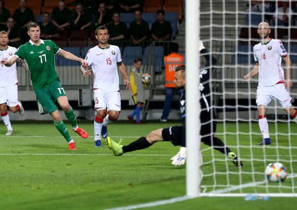 Northern Ireland's Paddy McNair scoring against Belarus