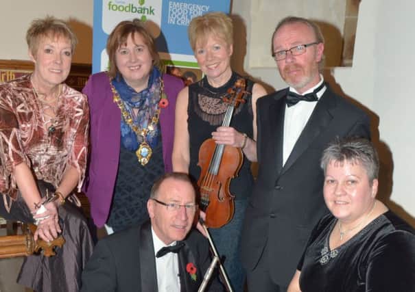 Archy McNeill (right) at St. Cedma's Church before a concert in aid of Larne Foodbank in 2013. INLT 46-331-PR