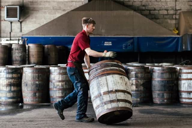 A cooper hard at work at the Speyside Cooperage. Pic: Peter McNally