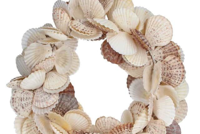 Undated Handout Photo of Talk To The Sand   Gisela Graham Natural Cream Scallop Shell Decorative Hanging Wreath, £18.50, Hurn & Hurn. See PA Feature INTERIORS Coastal. Picture credit should read: Hurn & Hurn/PA.. WARNING: This picture must only be used to accompany PA Feature INTERIORS Coastal. WARNING: This picture must only be used with the full product information as stated above.