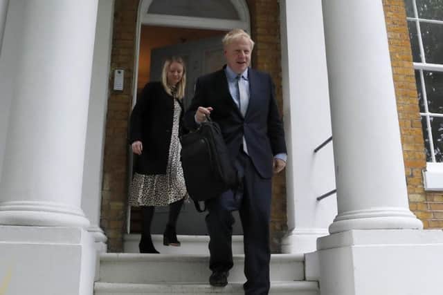 Boris Johnson leaves his home in London