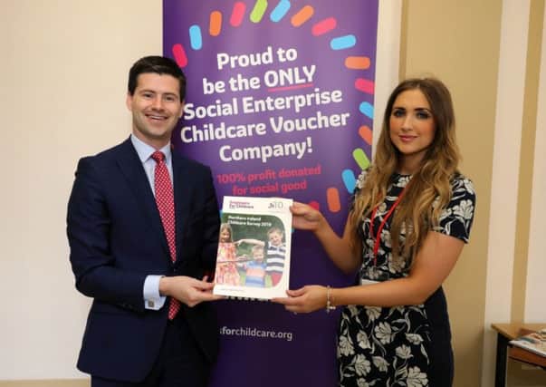 DUP MLA Jonathan Buckley with a representative from Employers for Childcare