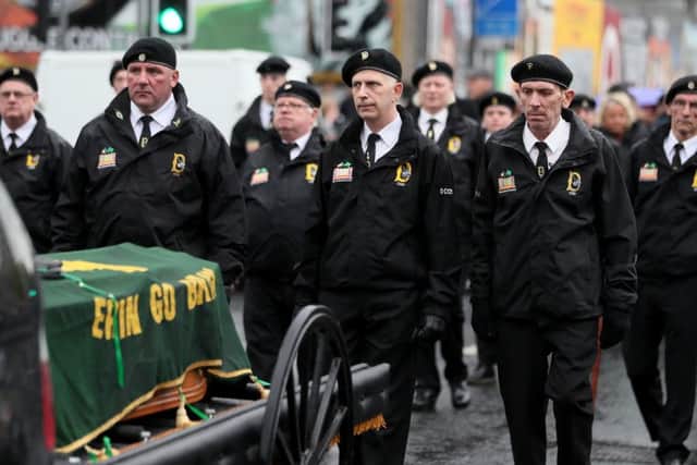 Members of 'D Company' take part in the funeral procession for former Provisional IRA leader Billy McKee in Belfast.