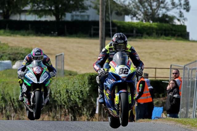 Derek Sheils (Burrows Engineering/RK Racing Suzuki) leads Michael Sweeney (MJR BMW) over the jumps at Kells on Sunday. Picture: Pacemaker Press.