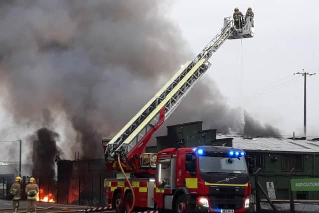 Fire crews bring the blaze at JP Corry under control. Pic: Pacemaker