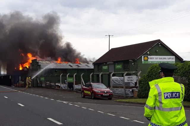Police closed part of the Ballymena-Ballymoney road while firefighters battled to bring the blaze under control. Pic: Pacemaker