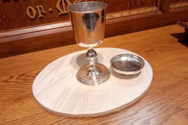 The communion silver presented by officers of a detachment of the Duke of Schomberg's army to the church in Glenavy in consideration of the kindness shown to them when quartered in the village