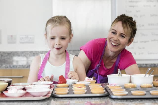 Mary-Anne Mackle of Wee Buns Cookery School in Moy showing Connie how to bake her own buns.