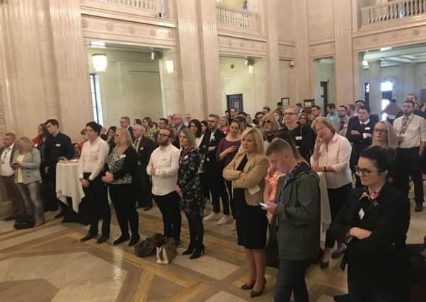 People at the PinkNews summer reception at Stormont last night listen to speakers, one of whom was Robin Swann. Photo: Rebecca Black/PA Wire