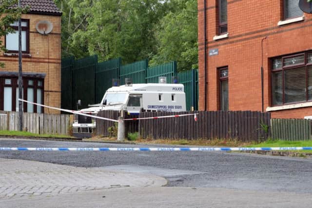 Police have launched an investigation after two people were found dead at house in West Belfast . 
The pair, understood to be a man and a woman, were discovered at a property in the Woodside Drive area of Poleglass on Thursday
