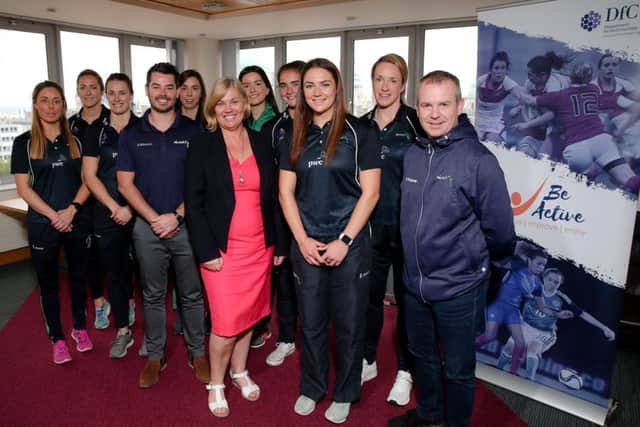Department for Communities Permanent Secretary Tracy Meharg pictured with the Northern Ireland Netball Team, Head Coach Dan Ryan and Geoff Wilson, Chair of Netball NI.