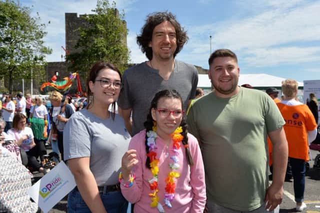 Gary Lightbody from Snow Patrol with Christina and Caroline Watson and David McEvoy at the Learning Disability Pride parade in Carrickfergus. INCT 22-003-PSB