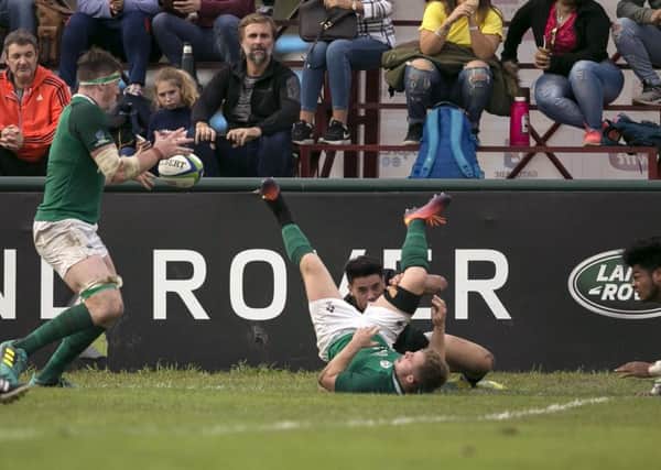 Ireland's Ryan Baird scores a try