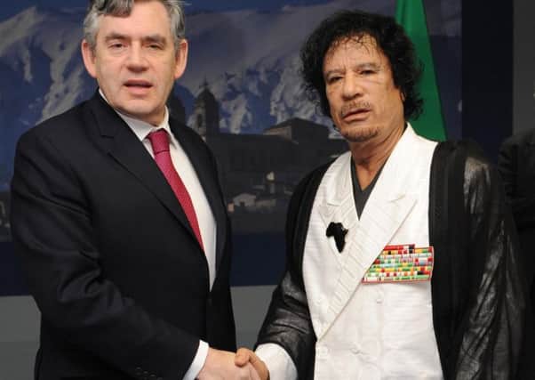 Prime Minister Gordon Brown meeting Muammar Gaddafi at the G8 Summit in L'Aquilla in 2009. Photo: Stefan Rousseau/PA Wire