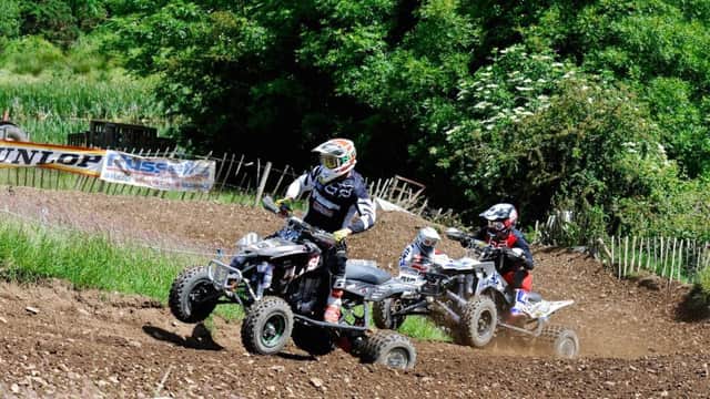 All action in the premier quads race between Mark McLernon, Dean Dillon and Justin Reid.
