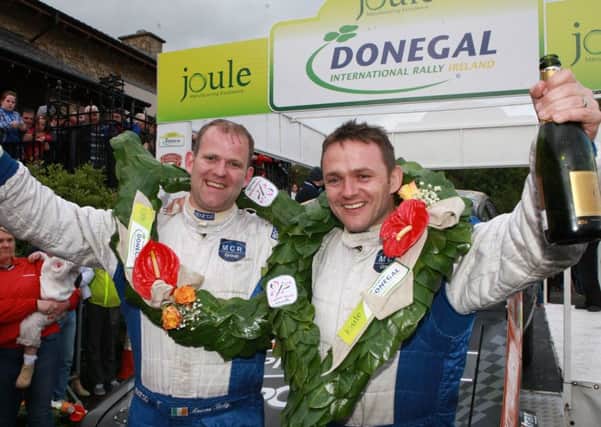 Manus Kelly (left) celebrates success with navigator Donal Barrett at a previous Donegal International Rally