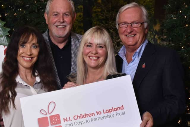 Gerry Kelly,  incoming president of The Northern Ireland Children to Lapland and Days to Remember Trust; Colin Barkley, the charity's new chair; Fiona Williamson, charity co-ordinator;and Lynne Rodgers, wife of the charity's late founder, Jack Rodgers MBE, and charity trustee.