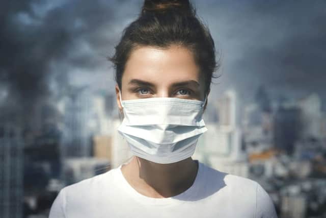 Wearing a face mask offers some protection from toxic air iStock/PA