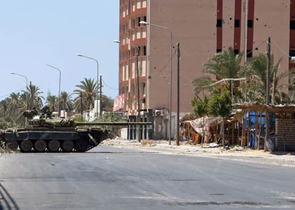 A tank in Zawiya, western Libya in August 2011, during Libyas civil war. That year Jason McCue travelled to the country to get a written commitment from the new Libyan government to pay UK victims compensation. (AP Photo/Gioulio Petrocco)