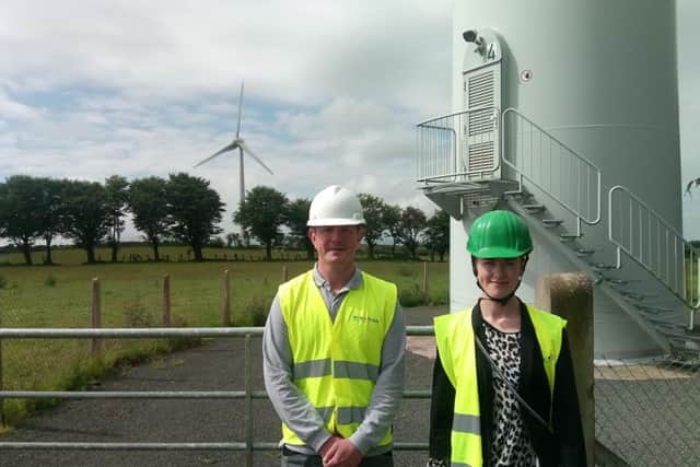 Carn Hill site manager Garret Walsh and NIRIG's Meabh Cormacain at the wind farm