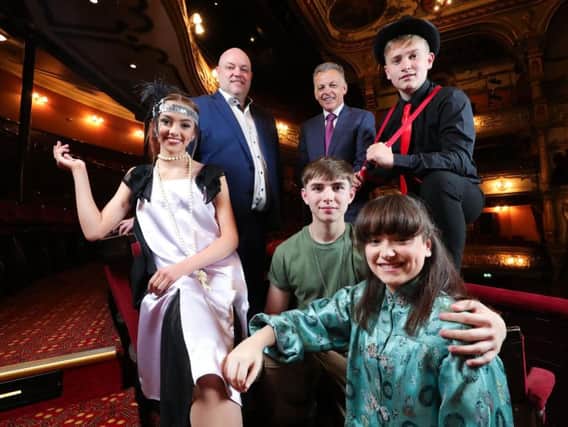 Pictured (left to right) Jasmine Mirfield as Tallulah from Bugsy Malone; Ian Wilson, Chief Executive of the Grand Opera House; Michael McKinstry, Chief Executive Officer of Phoenix Natural Gas; Robbie McMinn as Bugsy Malone, Nathan Johnston as Chris from Miss Saigon School Edition and Niamh McAuley as Kim from Miss Saigon School Edition.