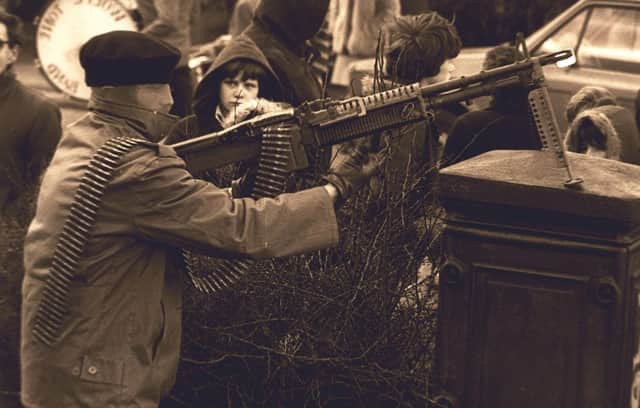 An IRA gunman displays an M60 Machine Gun on streets of Londonderry Pacemaker Press Intl. 29 Jan. 1978.  44/78/BWC