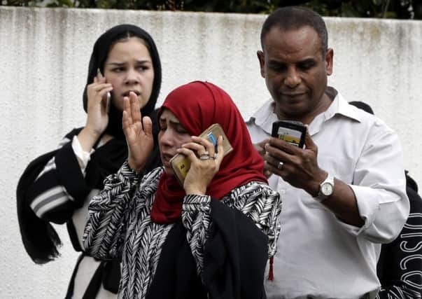 Distraught worshippers at the scene of one of the New Zealand mosque shootings