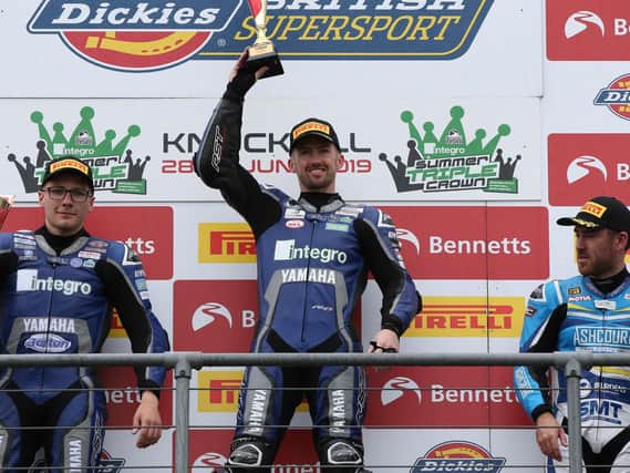 Jack Kennedy celebrates his victory in the British Supersport Sprint race at Knockhill with runner-up Brad Jones and Lee Johnston (right).
