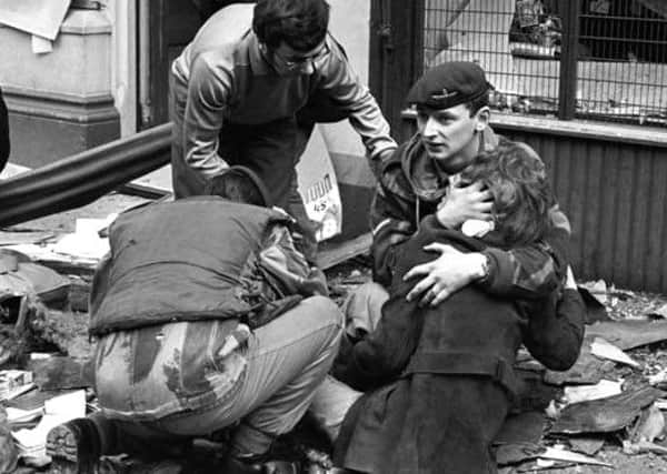 The soldier cradling Ms Suehiro in the aftermath of the explosion