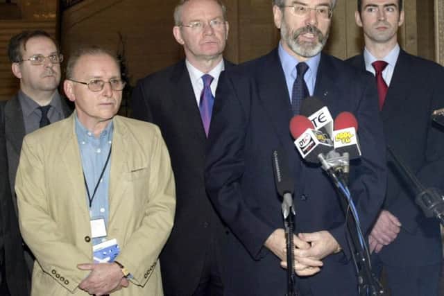 Mr. Donaldson pictured alongside Martin McGuinness and Gerry Adams in Stormont.