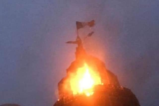 Above Cllr Margaret Tinsley is an Irish Tricolour on top of Edenderry bonfire