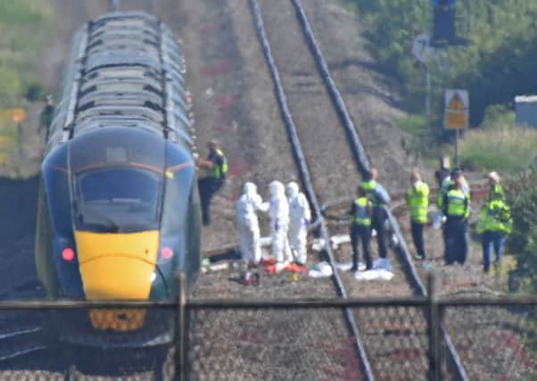 The scene on a section of track near Port Talbot after two railway workers died after being struck by a train.  PRESS ASSOCIATION