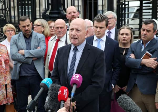 Relatives of those bereaved by the 'Glenanne Gang at Belfast High Court on Friday. 
Edward Barnard speaks to the media after the hearing. Pacemaker
