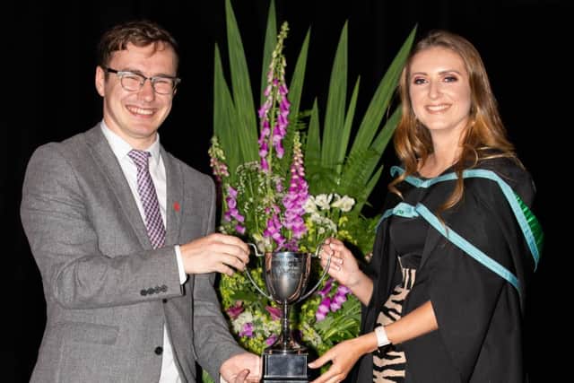 Emma Jefferson received her awards from Adam Leahy, former Stranmillis Students Union president and Princes Trust operation manager.