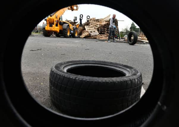 08/07/2019:  Bonfire builders at Avoniel leisure centre voluntarily remove tyres from their bonfire this afternoon after a ruling from the city council.