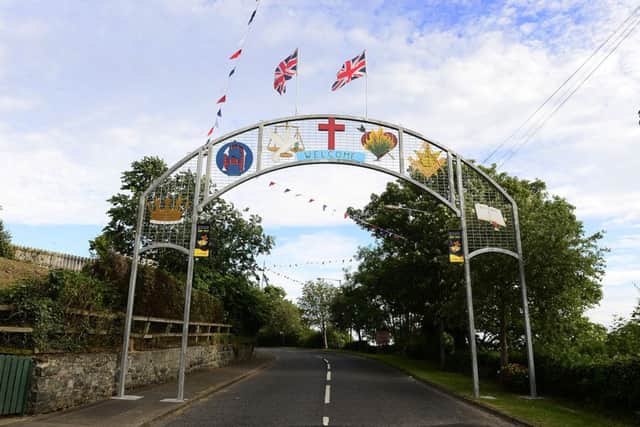 The Orange arch welcoming visitors to Scarva. 
Picture by Arthur Allison.