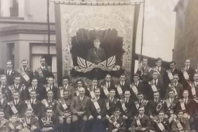 A photo from 100 years ago showing LOL 1050 with the James McLaurin banner
