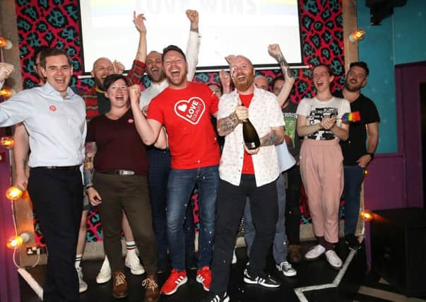 Members of the LGBT community celebrate at the Maverick bar, Belfast, as same-sex marriage in Northern Ireland came a step closer after MPs voted to legalise it if a new Stormont Executive is not formed by October. Photo credit: Peter Morrison/PA Wire