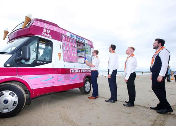 Orange men queue for some ice-cream on the beach.   Picture by Jonathan Porter/PressEye
