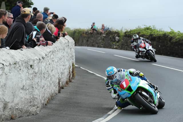 Dean Harrison leads Michael Dunlop in Thursday's Senior race at the Southern 100. Picture: Dave Kneen/Pacemaker Press.