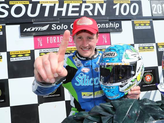 Dean Harrison celebrates his third straight win in the Solo Championship race at the Southern 100 on Thursday. Picture: Dave Kneen/Pacemaker Press.