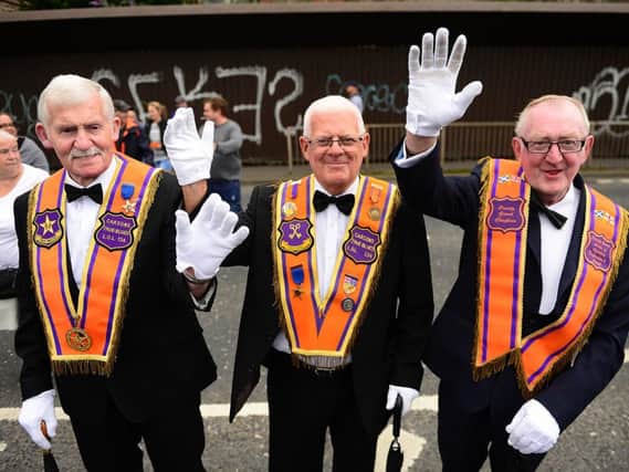 Orange brethren wave for the camera at the Belfast demonstration. Pics: Arthur Allison, Pacemaker