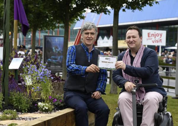 Patrick Merrick (left) is presented with a bronze award from Mark Lane at the Gardeners' World Beautiful Borders competition at the NEC in Birmingham.