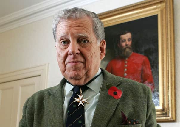 Col Robin Charley, veteran of the Korean War in the Royal Ulster Rifles, in front of a portrait of his Grandfather William Charley.
Picture by Brian Little