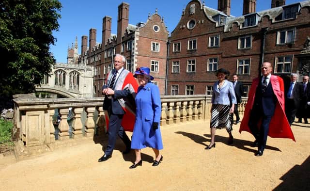 The Queen and Prince Philip at St Johns College, at the University of Cambridge. Institutions such as the monarchy, universities and BBC are still the envy of much of the world, says John Kyle. Photo: Chris Radburn/PA Wire